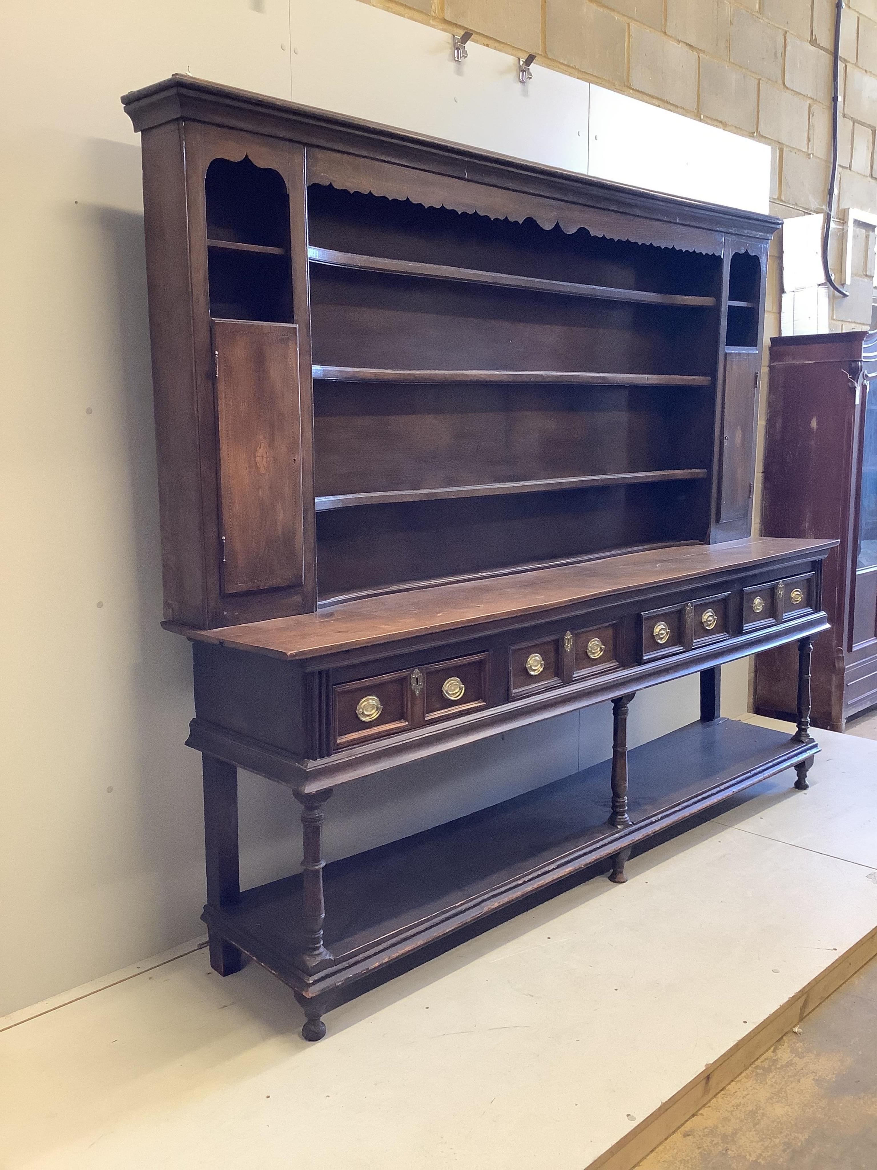 A George III oak pot board dresser with associated boarded rack, width 234cm, depth 49cm, height 197. Condition - fair